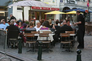 Belgium, Brussels, cafe, day, eye level view, group, overcast, people, restaurant, sitting, street, summer, waiter