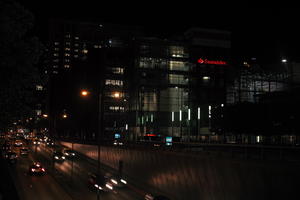 artificial lighting, building, car lights, city lights, England, eye level view, London, night, spring, street, The United Kingdom, traffic, tunnel, urban