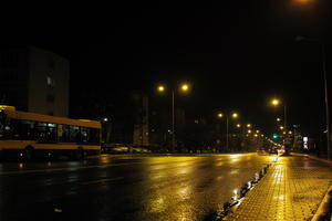 artificial lighting, city lights, eye level view, Kalisz, night, outdoor lighting, pavement, Poland, street, urban, wet, Wielkopolskie, winter