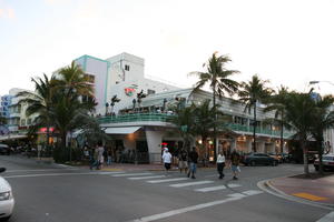architecture, artificial lighting, balcony, building, evening, eye level view, Florida, group, hotel, Miami, palm, people, railing, restaurant, street, The United States, tree, vegetation, walking