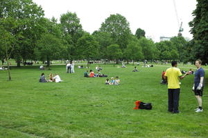 day, England, eye level view, grass, Hyde Park, London, overcast, park, people, sitting, spring, standing, The United Kingdom, tree, vegetation