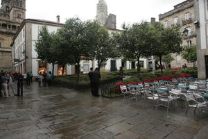 bush, cafe, chair, day, eye level view, furniture, Galicia, garden, group, overcast, people, Santiago de Compostela, Spain, square, tree