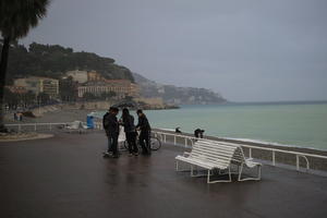 bench, coastline, eye level view, France, Nice, overcast, pavement, people, Provence Alpes Cote D