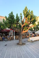 bench, building, cafe, chair, couple, Croatia, day, dusk, eye level view, family, furniture, group, Makarska, object, people, plaza, sitting, Splitsko-Dalmatinska, table, tree, vegetation