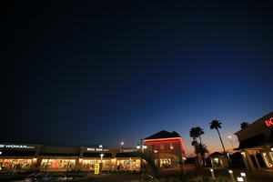artificial lighting, dusk, eye level view, Florida, mall, Miami, object, palm, retail, sign, The United States, vegetation