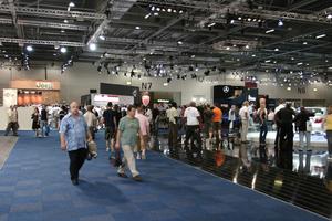 architecture, artificial lighting, ceiling, crowd, England, exhibition, eye level view, group, interior, London, people, The United Kingdom, walking