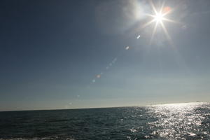 autumn, Barcelona, bright, Cataluña, clear, day, eye level view, reflected, seascape, sky, Spain, sun, sun glare, sunny, water, waves