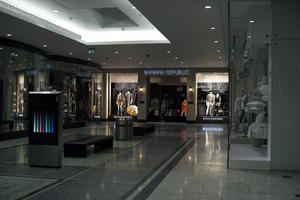 artificial lighting, ceiling, England, eye level view, floor, London, night, shop, shopping centre, The United Kingdom
