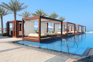 bed, day, direct sunlight, Dubai, Dubayy, eye level view, natural light, palm, plant, pool, sunbed, sunlight, sunny, sunshine, The United Arab Emirates, tree