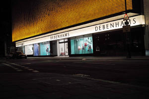 artificial lighting, England, eye level view, London, night, outdoor lighting, retail, shop, sign, street, The United Kingdom