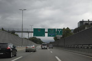 autumn, car, day, diffuse, diffused light, eye level view, natural light, overcast, road, sign, Switzerland, urban