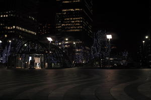 artificial lighting, building, building, city, cityscape, England, eye level view, London, night, paving, plaza, station, The United Kingdom, winter