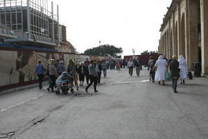 autumn, day, eye level view, group, Malta, Malta, natural light, nun, people, street, walking