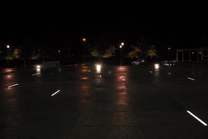 artificial lighting, building, city, Croatia, eye level view, night, pavement, pavement, paving, plaza, spring, wet, Zadar, Zadarska